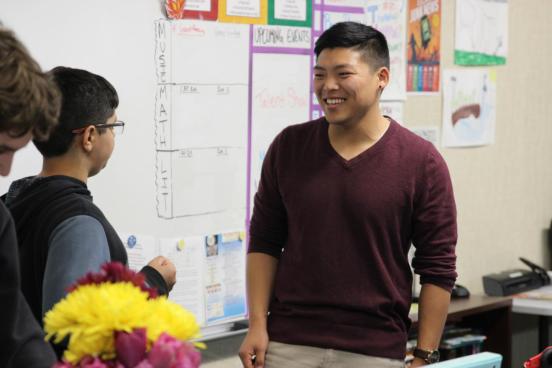 alumni teaching a student alumni teaching to student in a classroom